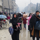 Syrian residents flee to the Fardos neighborhood of Aleppo, which was recently retaken by a regime that is said to be summarily executing civilians. Image via STRINGER/AFP/Getty Images.